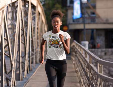 White T-shirt featuring a festive 'Tequila and Tacos' design with a smiling taco character, tequila bottle, margarita glass, lime slices, and chili peppers. Perfect for celebrating fiestas and taco nights with a fun and lively style.