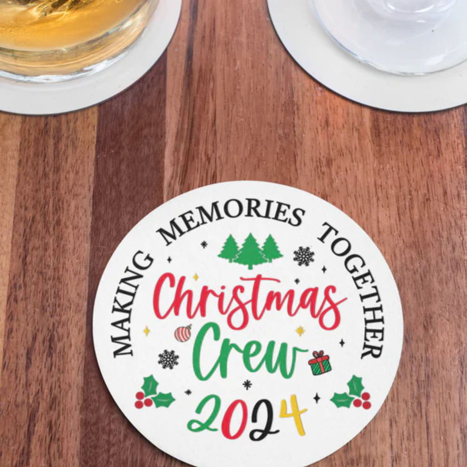 Christmas Crew 2024 ceramic coaster with festive design featuring trees, holly, snowflakes, and gift icons. Text reads 'Making Memories Together,' ideal for holiday gatherings, Christmas parties, and seasonal decor. Perfect for adding a cheerful touch to holiday tables and drinkware.