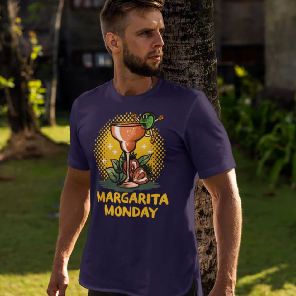 Man wearing a purple T-shirt with a "Margarita Monday" design featuring a colorful margarita glass illustration and vibrant background. This stylish Margarita Monday T-shirt design is perfect for celebrating Margarita Monday in a fun, casual style. The scene captures a relaxed outdoor vibe, ideal for any Margarita Monday enthusiast.